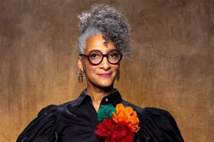 Carla Hall posing at her book signing,