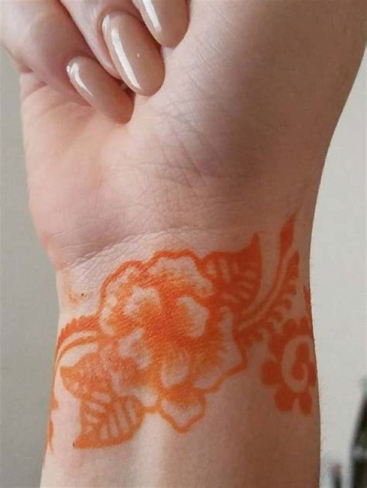 Orange mehendi tattoos