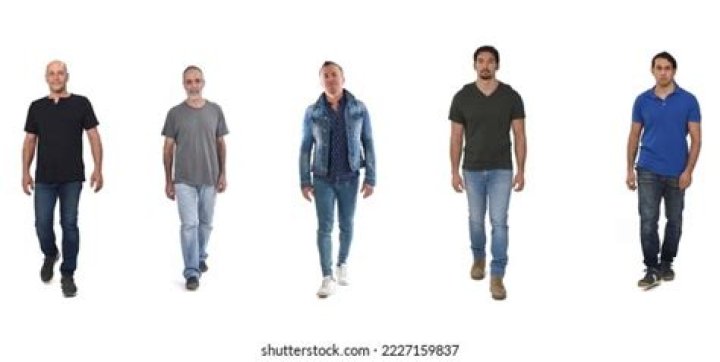 People walking by the front of a Starbucks location
