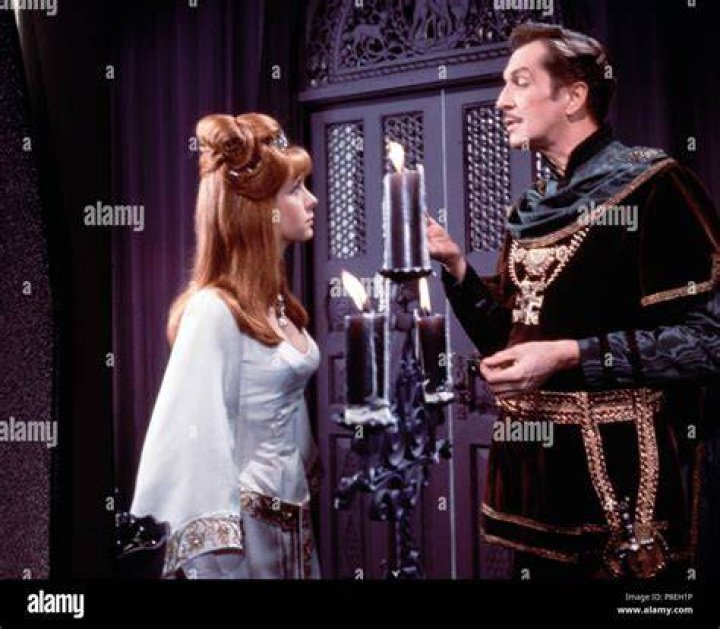 Vincent Price and Jane Asher watching actor David Weston, who is held at swordpoint in a scene from the film 'The Masque of the Red Death', 1964